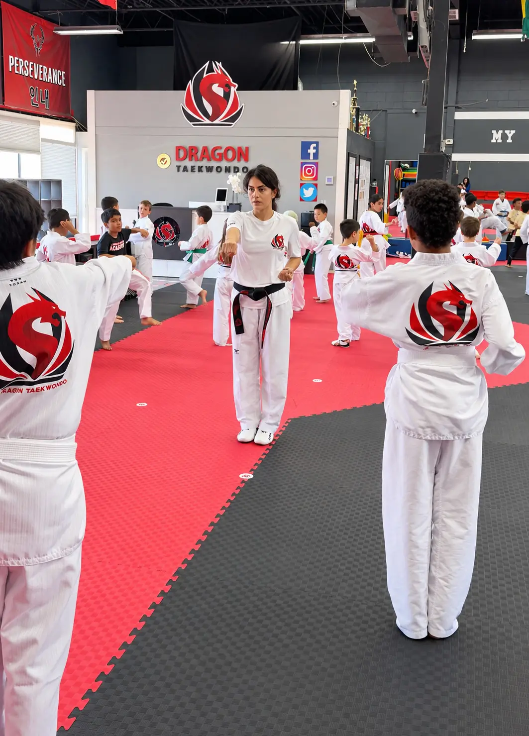 A Dragon Taekwondo class on the mats beside the school’s front desk