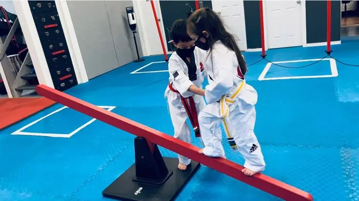 Two young students on the balance beam