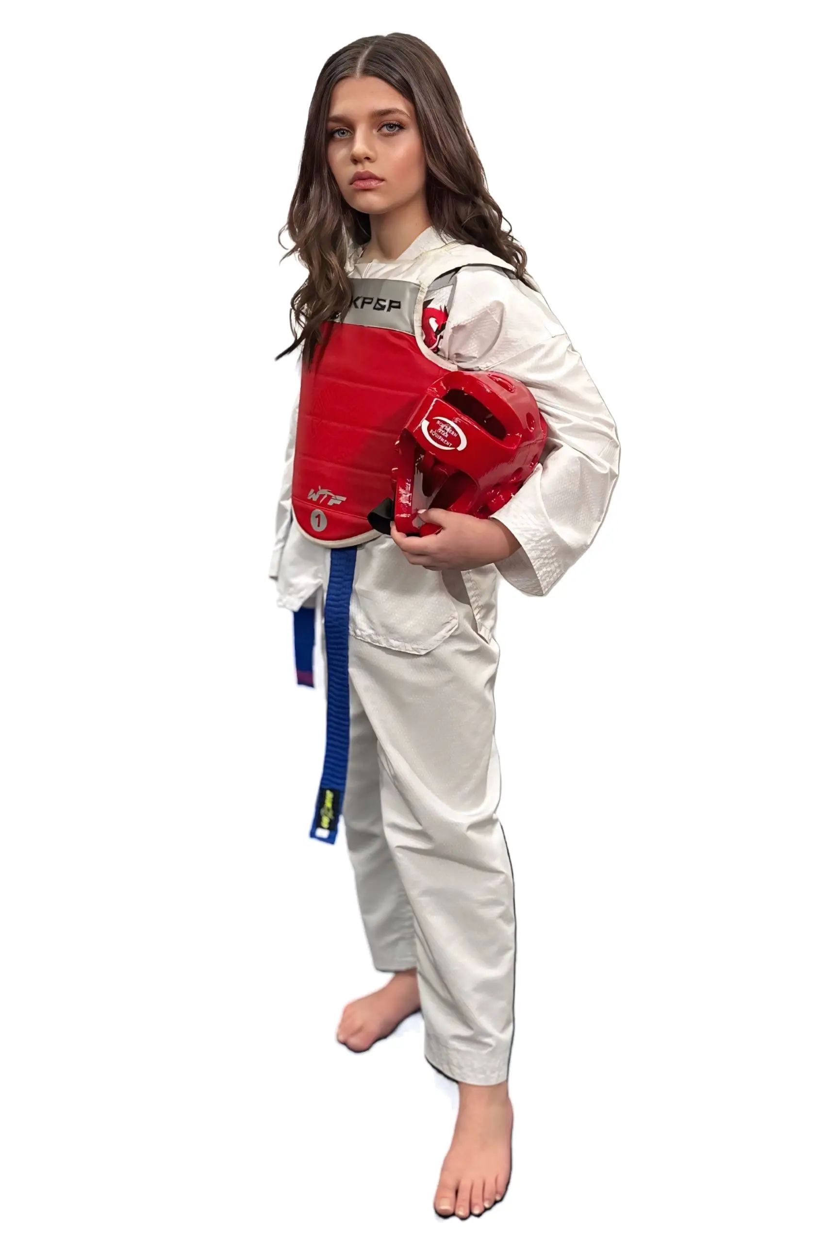 A Dragon Taekwondo student holding a sparring helmet and wearing a chest protector