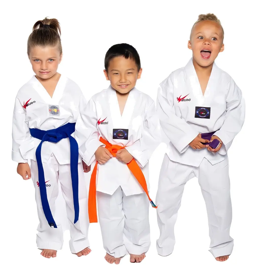 Three Little Dragons students in white uniforms, smiling
